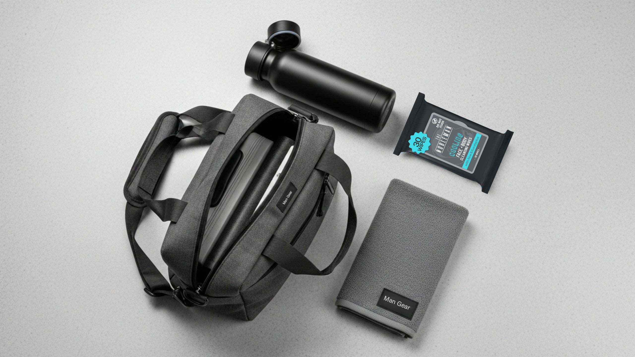 The Nobleman Men’s Cooling Eucalyptus Face and Body Cleansing Wipes on a gym flat-lay background