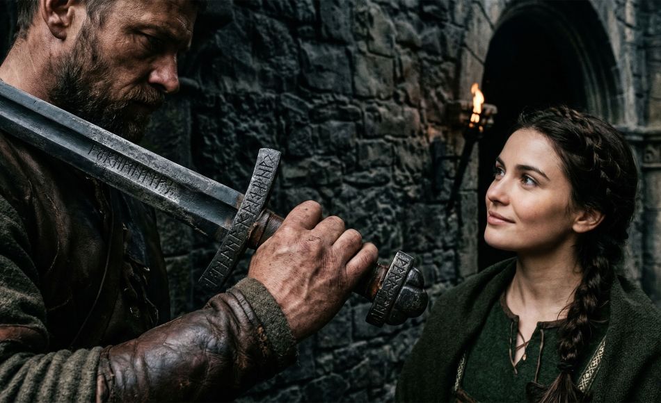 A man's hands gripping a traditional symbol of heritage and protection.