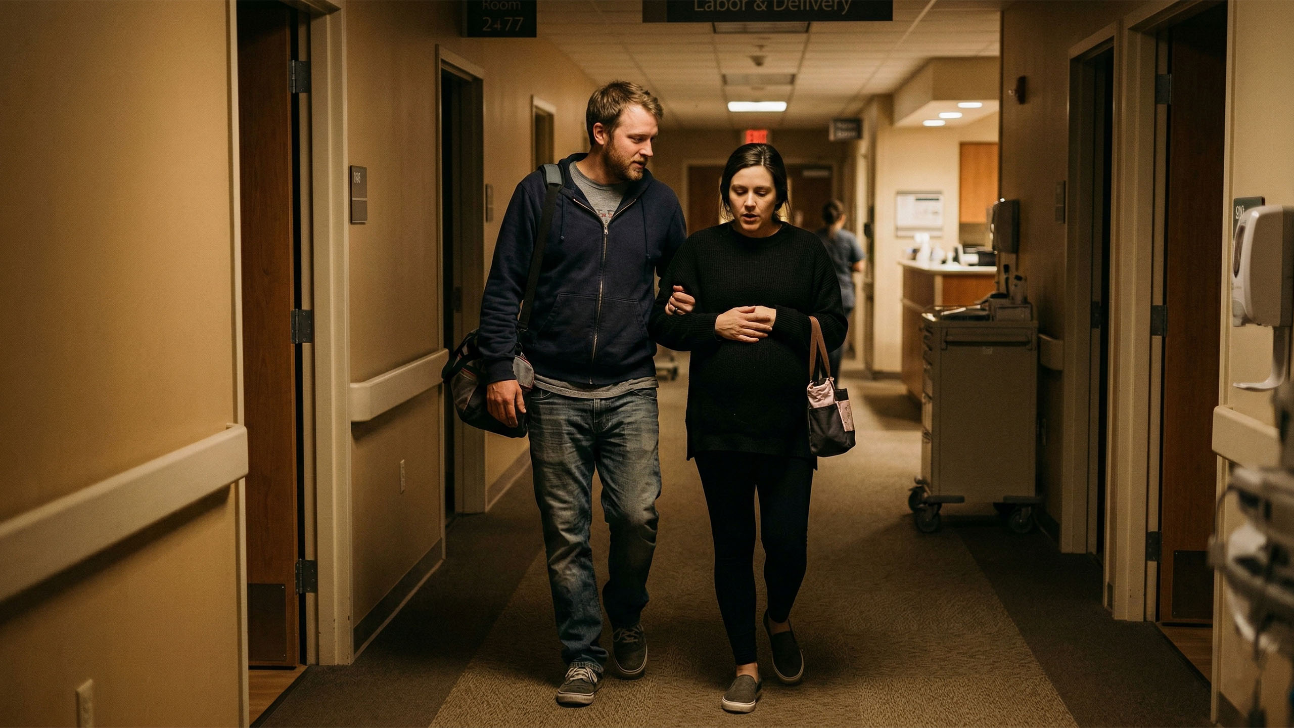 A father to be walking with his wife to the maternity unit, emotional and overwhelmed with love