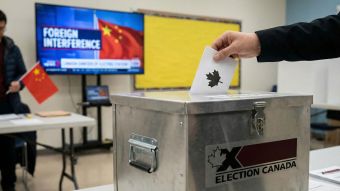 A man observing a city skyline symbolizing the intersection of masculinity and national sovereignty.