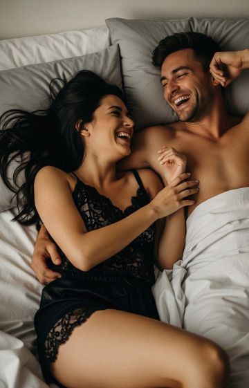 Couple enjoying intimacy and playful exploration.