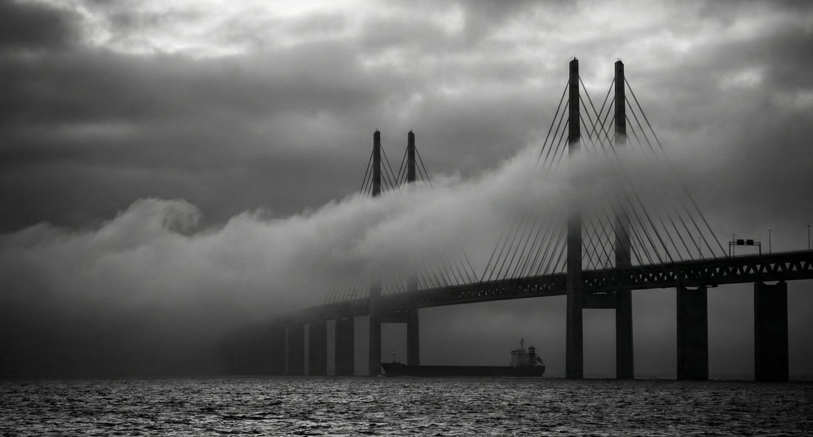 A foggy view of the Oresund Bridge connecting Denmark and Sweden.